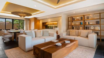 Three-Bedroom Family Residence | Living room | 50-inch Smart TV with digital channels, TV, books