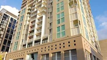 A multi-story hotel with a modern design, featuring a prominent entrance and a visible sign indicating a restaurant or dining area.