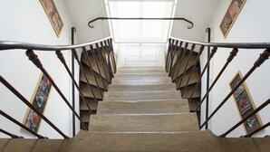 A wooden staircase with metal railings and a window at the top. - Ma Normandie by Popinns (Breville-les-Monts)