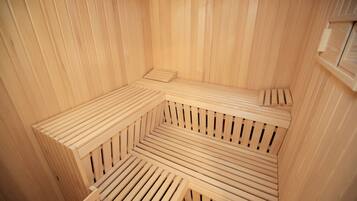 A sauna with wooden benches arranged in a semi-circular pattern.