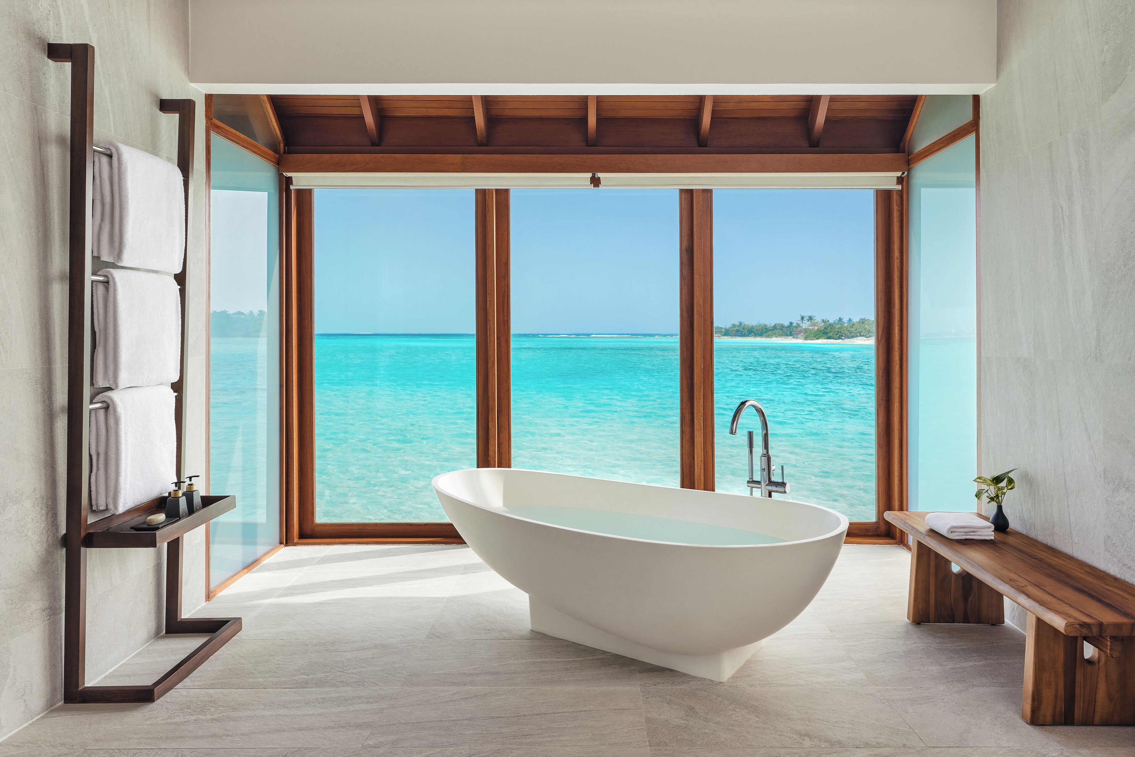 sunrise over water villa | bathroom | separate bathtub and shower, deep-soaking bathtub, rainfall showerhead