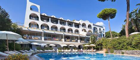 Indoor pool, outdoor pool, open 8 AM to 7 PM, pool umbrellas