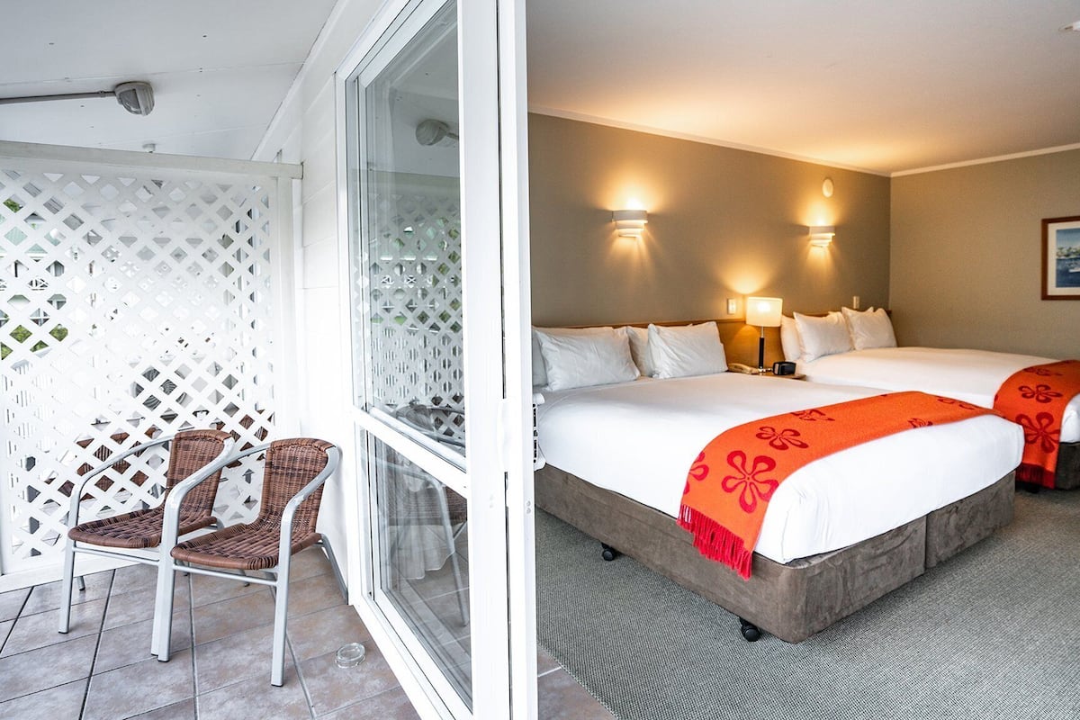 superior room, 2 queen beds | in-room safe, desk, iron/ironing board, free cots/infant beds