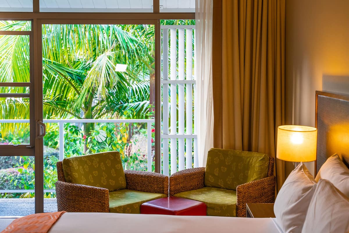 deluxe room, 2 queen beds | in-room safe, desk, iron/ironing board, free cots/infant beds