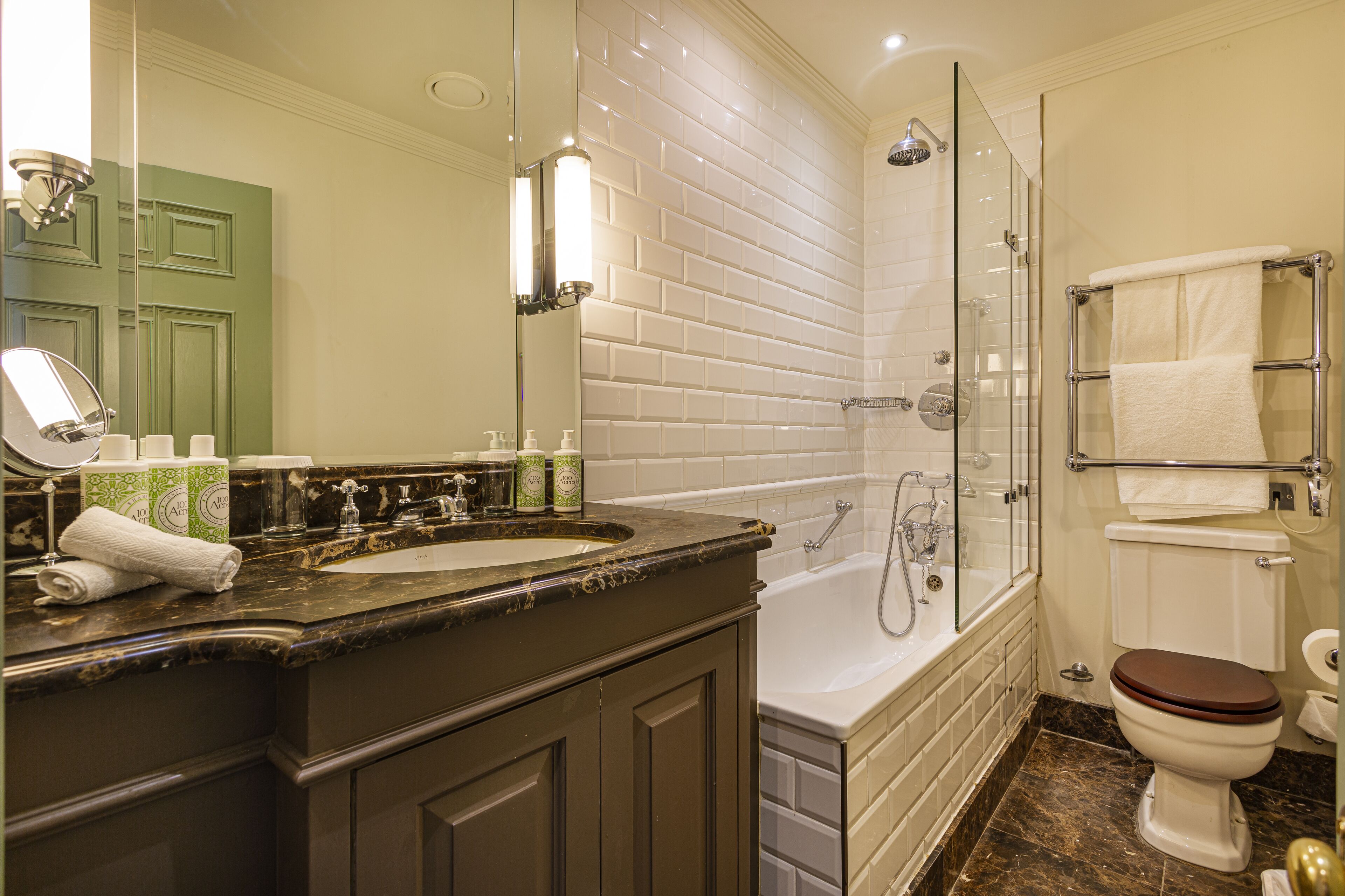 deluxe double room | bathroom | rainfall showerhead, designer toiletries, hair dryer, bathrobes