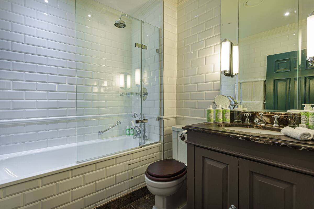 classic double room | bathroom | rainfall showerhead, designer toiletries, hair dryer, bathrobes