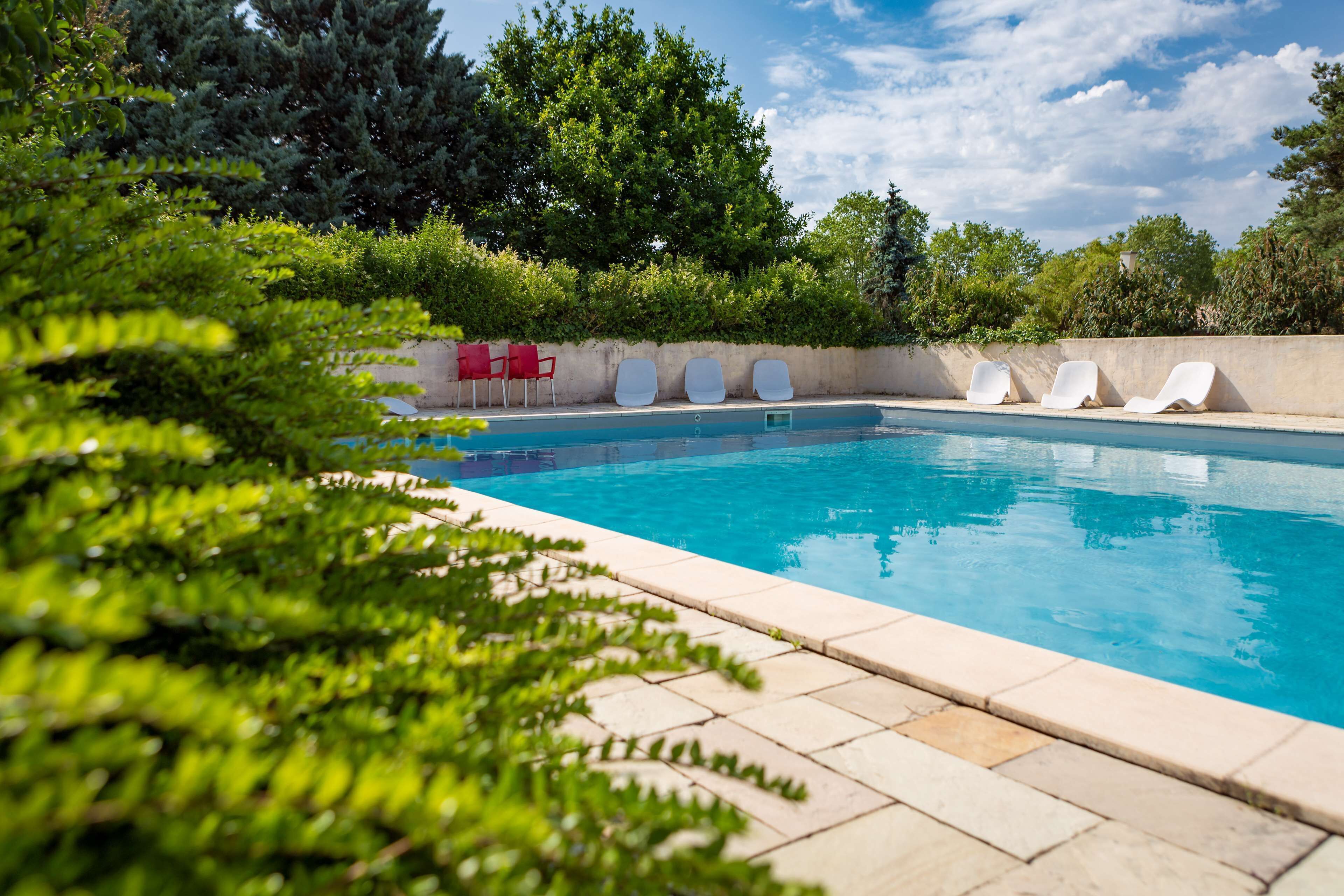 seasonal outdoor pool, open 9:00 am to 9:00 pm, pool loungers
