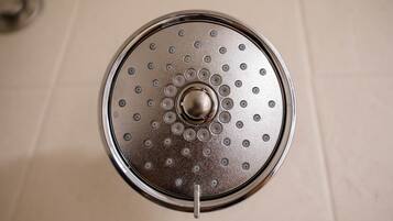 A circular object with a central knob and multiple holes around the edge.