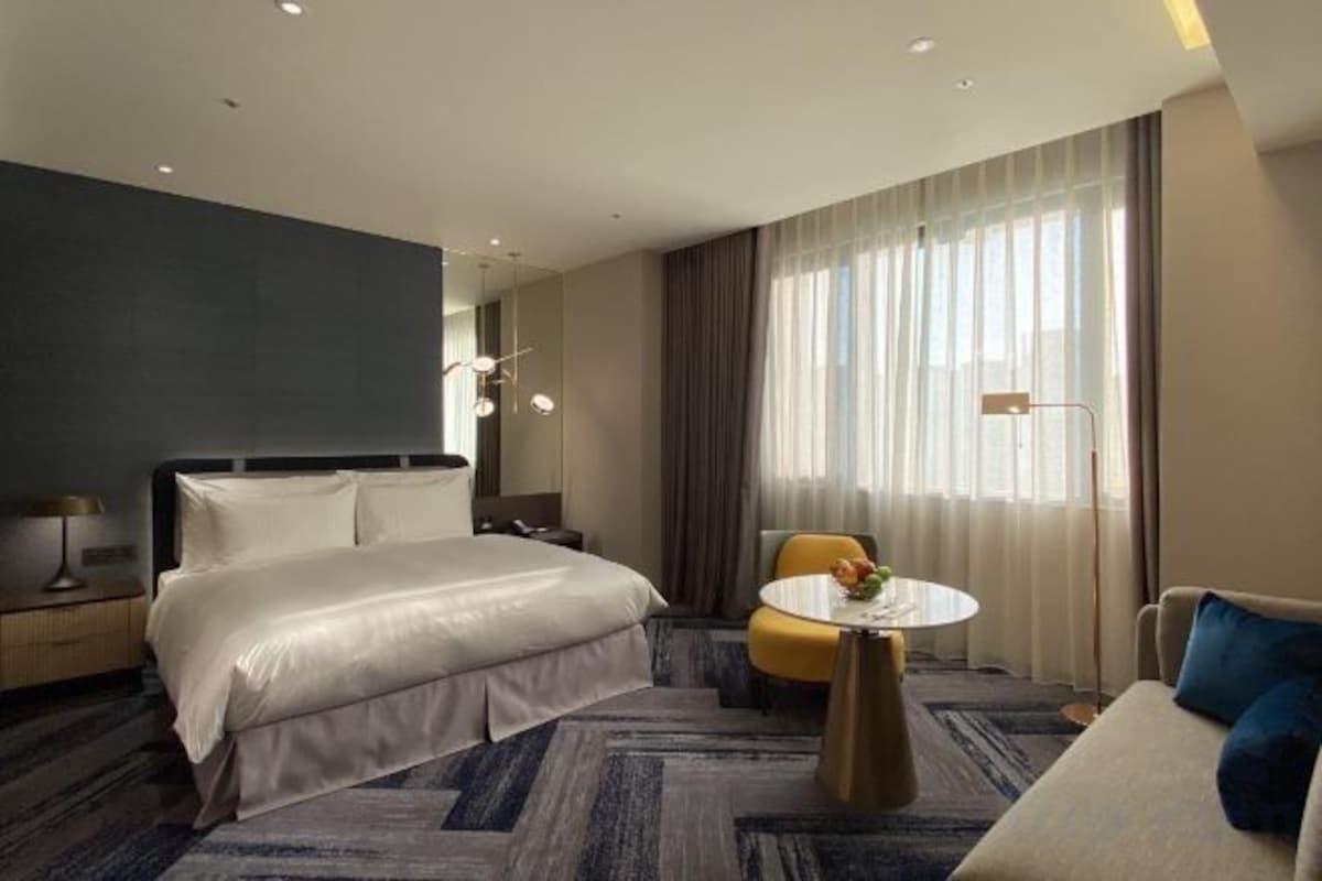 Down duvets, pillow-top beds, in-room safe, laptop workspace