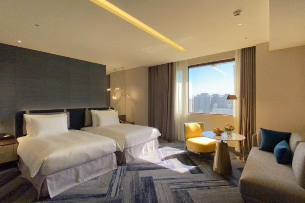 Down duvets, pillow-top beds, in-room safe, laptop workspace