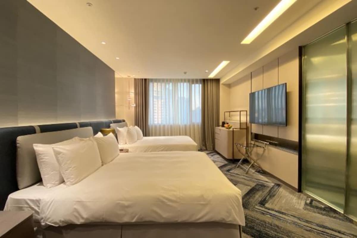 Down duvets, pillow-top beds, in-room safe, laptop workspace