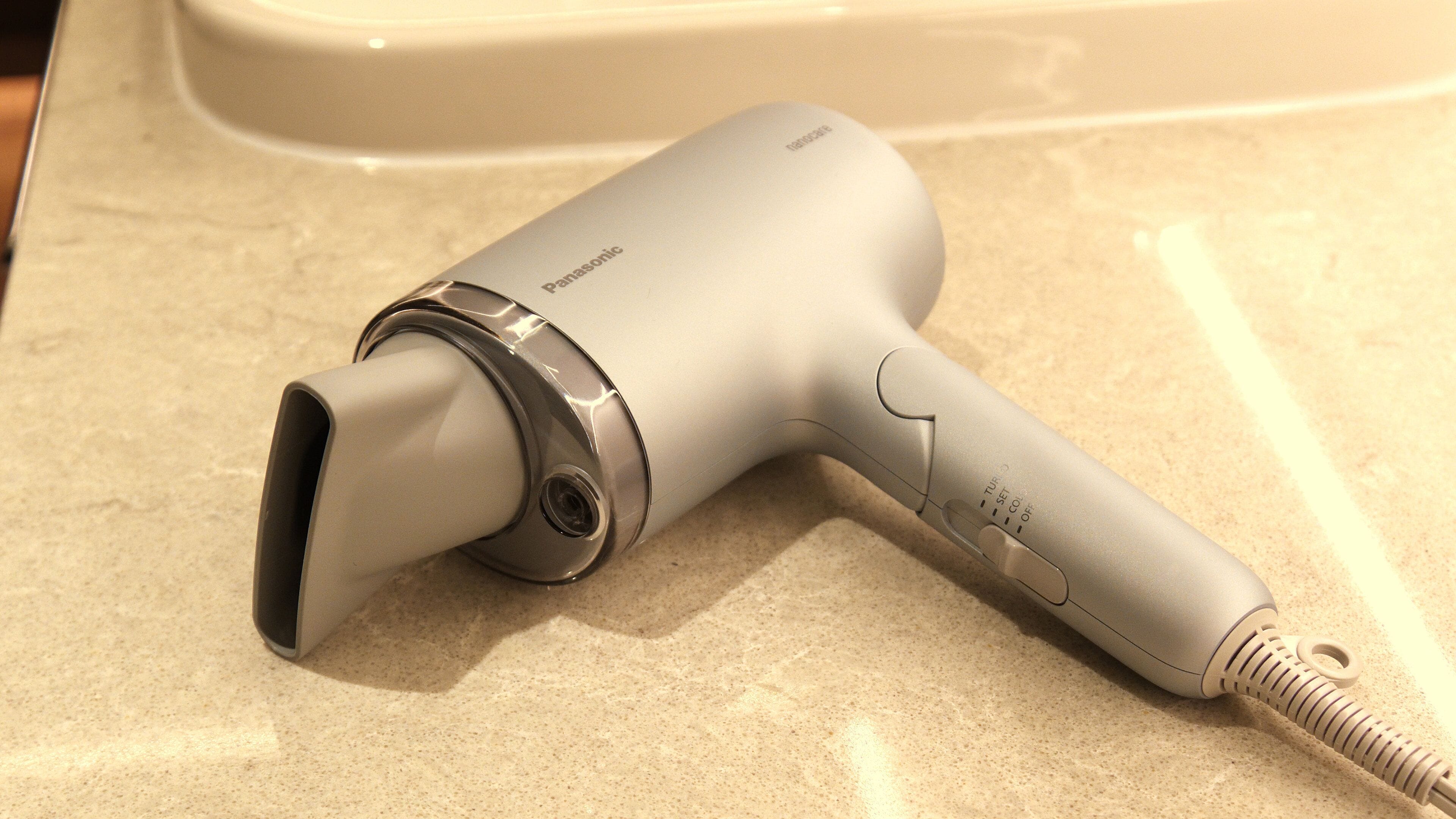 A Panasonic hair dryer on a countertop.