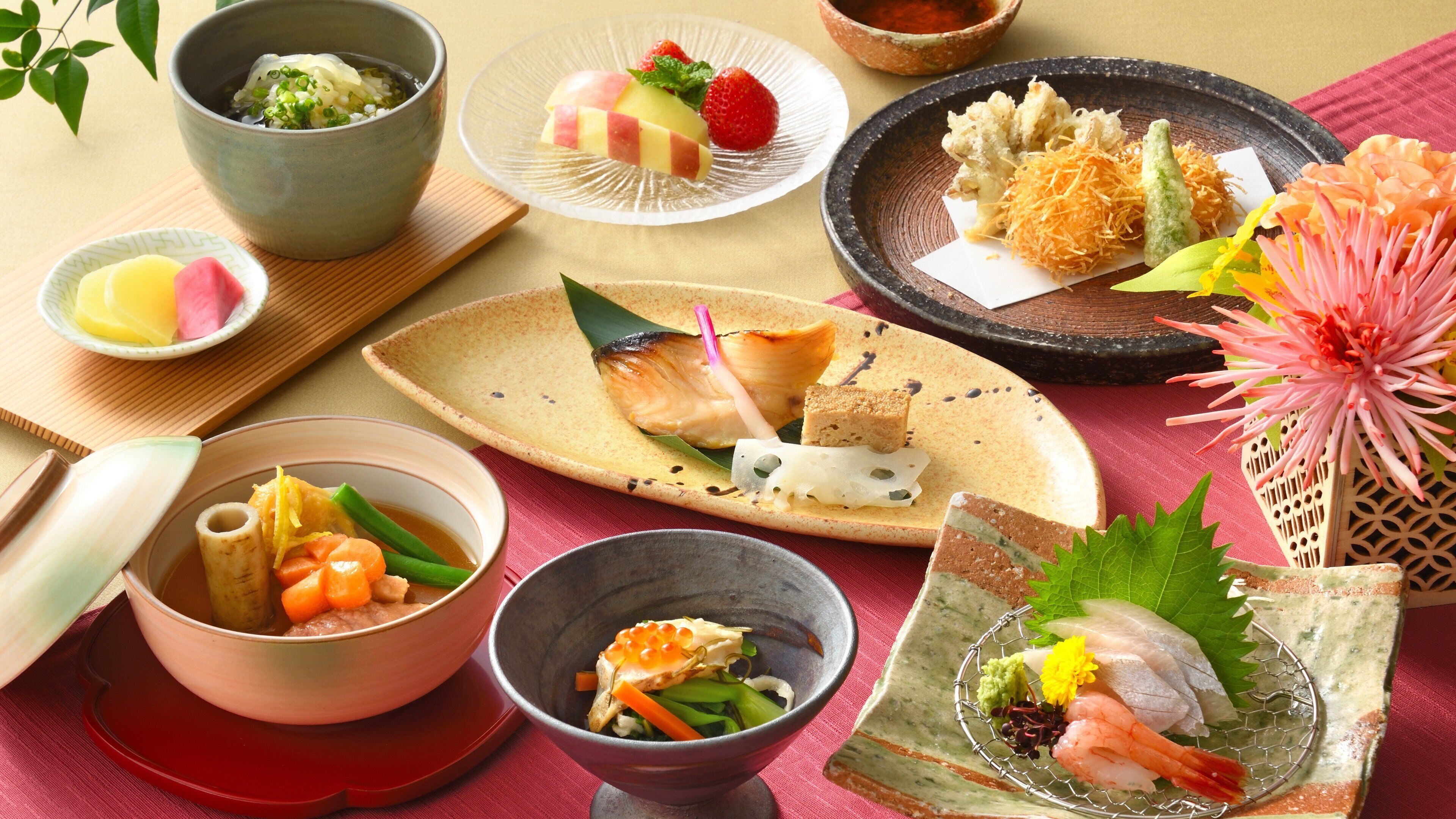 A variety of Japanese dishes arranged on different plates and bowls.