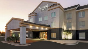 A Fairfield by Marriott Inn & Suites building with a modern design, featuring a prominent entrance with glass doors and a covered area. - Fairfield Inn & Suites by Marriott Tampa Fairgrounds/Casino (Tampa)