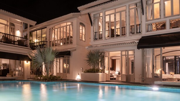 A large, multi-story building with a swimming pool in the foreground. - B House Samui (Koh Samui)