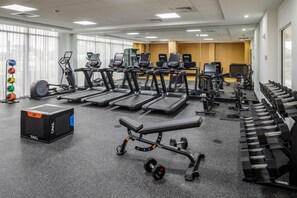 A gym with treadmills, weight machines, and dumbbells. - DoubleTree by Hilton Sarasota Bradenton Airport (Sarasota)