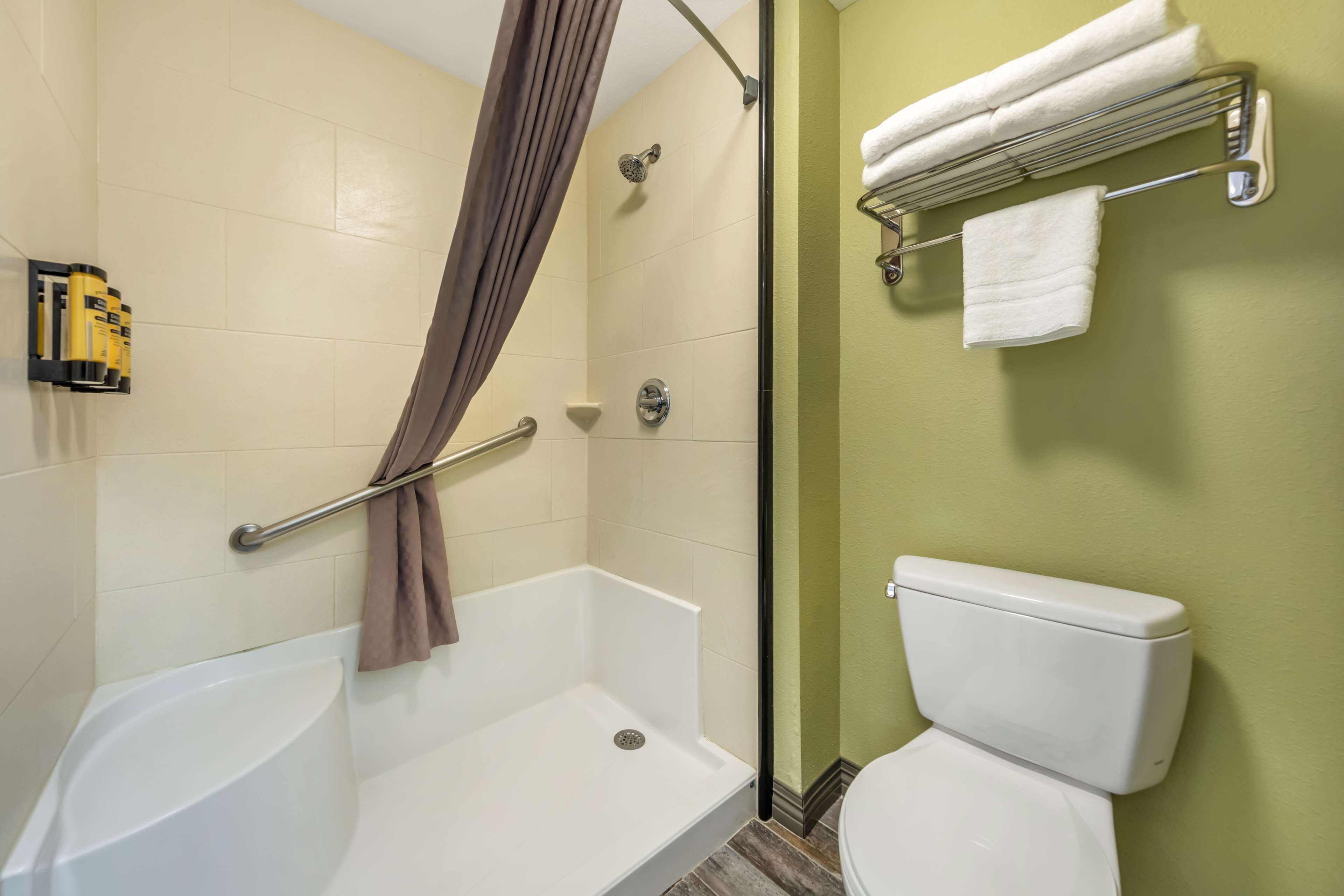combined shower/bathtub, designer toiletries, hair dryer, towels