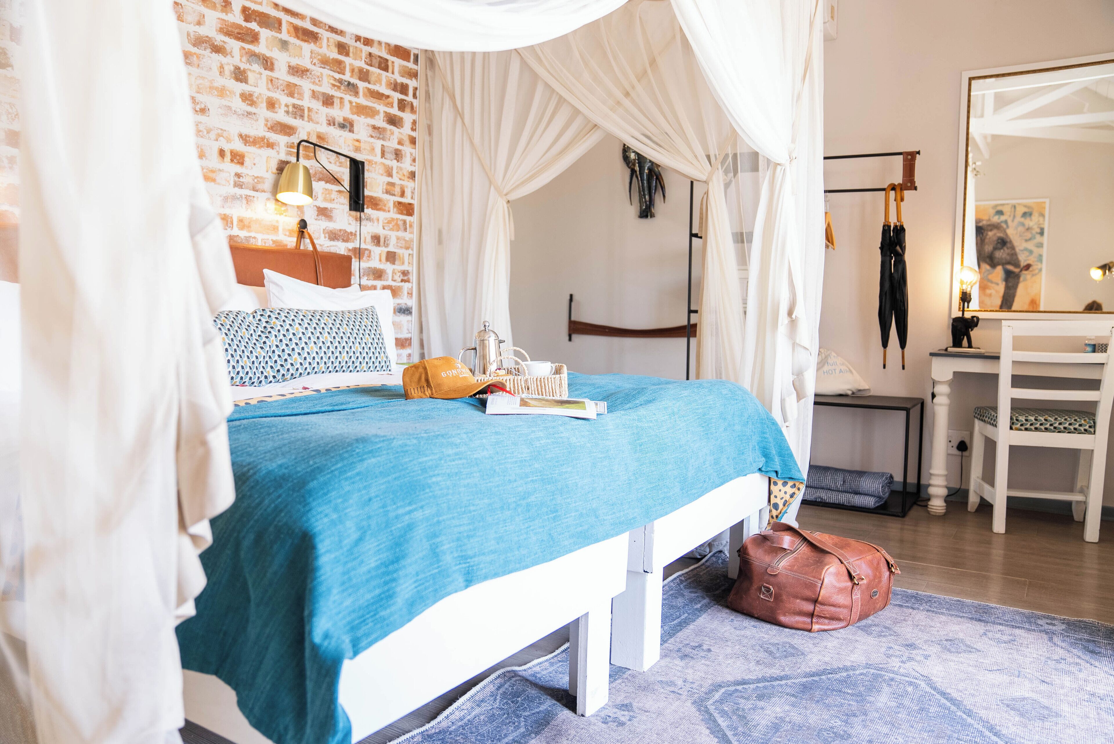 Desk, laptop workspace, bed sheets