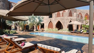 Outdoor pool, pool umbrellas, sun loungers