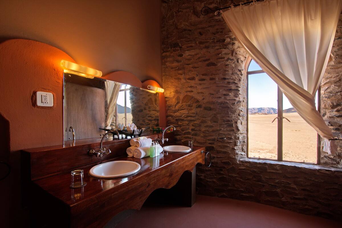 camelthorn | bathroom | deep-soaking bathtub, rainfall showerhead, free toiletries, hair dryer