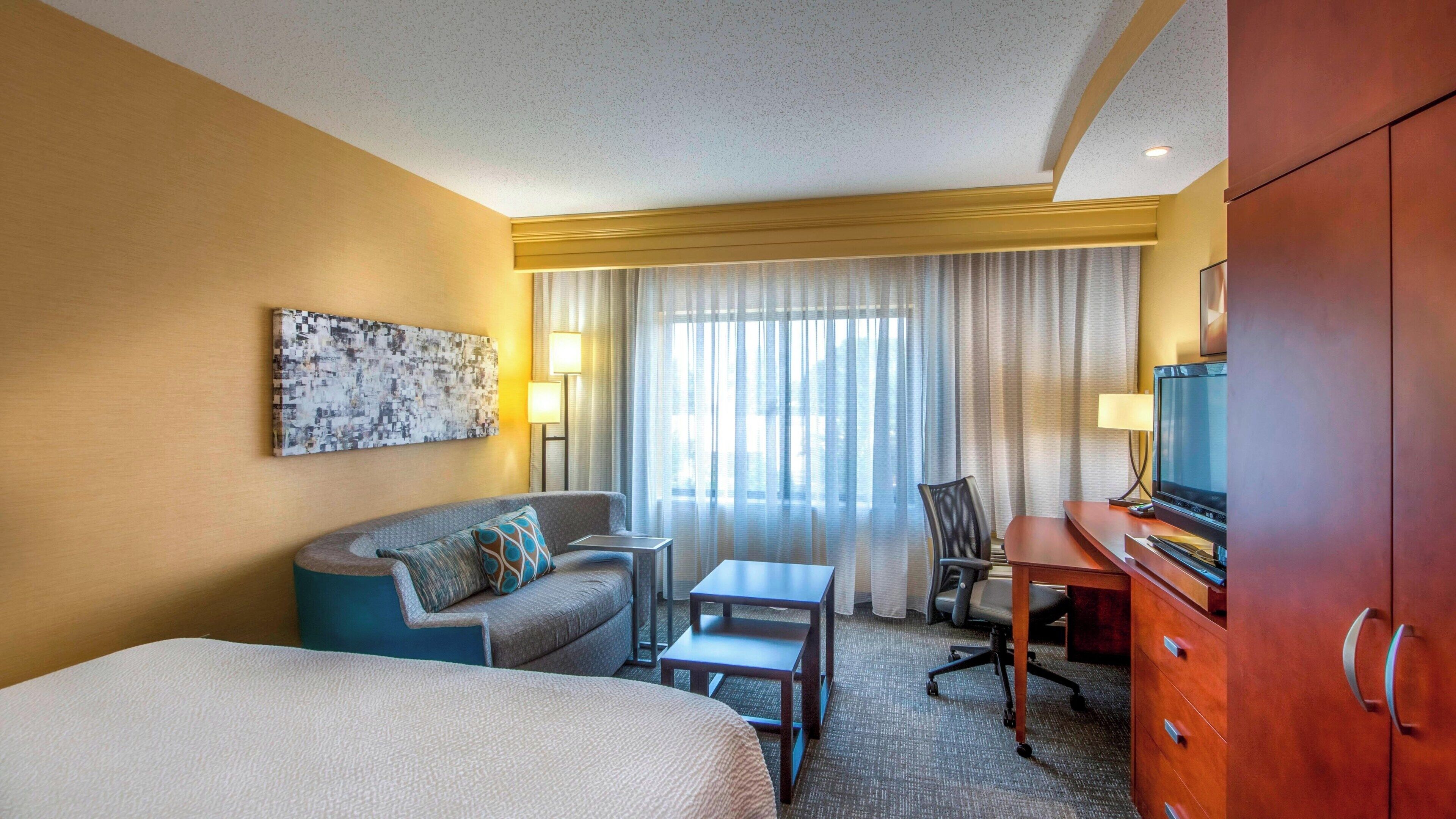 premium bedding, pillow-top beds, desk, laptop workspace