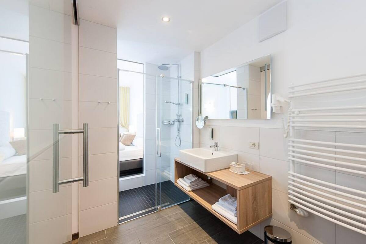 double room, garden area | bathroom | hair dryer, towels, soap, shampoo