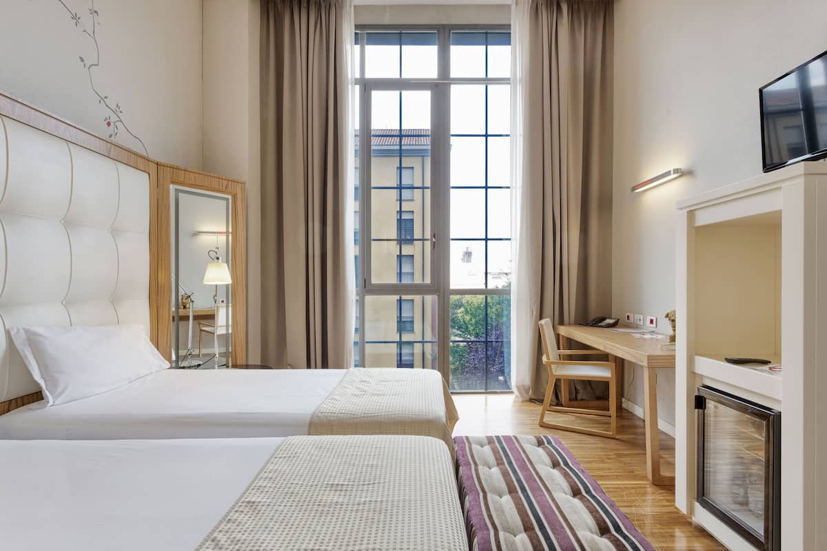 Premium bedding, down duvets, minibar, in-room safe