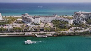 A resort with multiple buildings, a marina, and a beach.