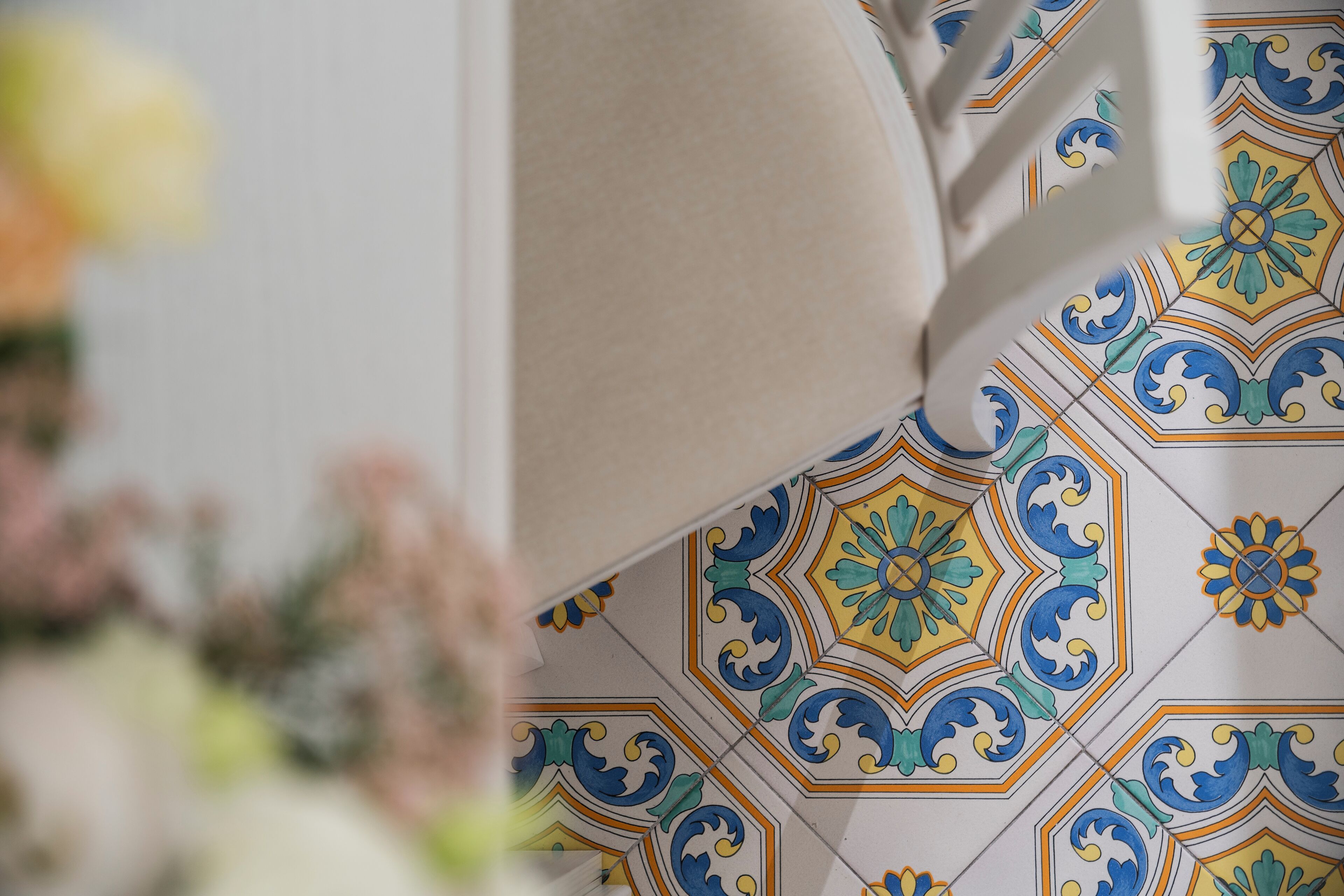 A close-up of a tiled floor with a geometric pattern.