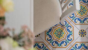 A close-up of a tiled floor with a geometric pattern.