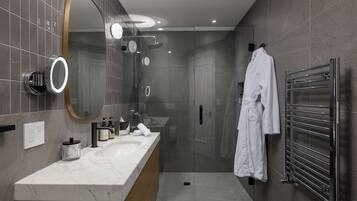 Rockwell King Suite | Bathroom | Eco-friendly toiletries, hair dryer, bathrobes, towels