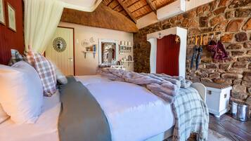 In-room safe, desk, laptop workspace, bed sheets