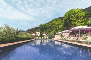 Seasonal outdoor pool, open 10:00 AM to 7:00 PM, sun loungers
