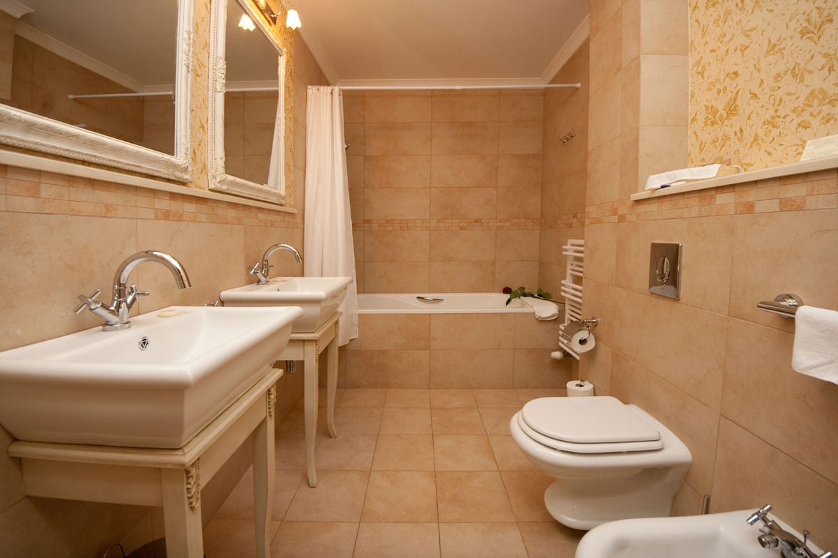 studio suite (building a, no ac) | bathroom | free toiletries, hair dryer, bathrobes, slippers