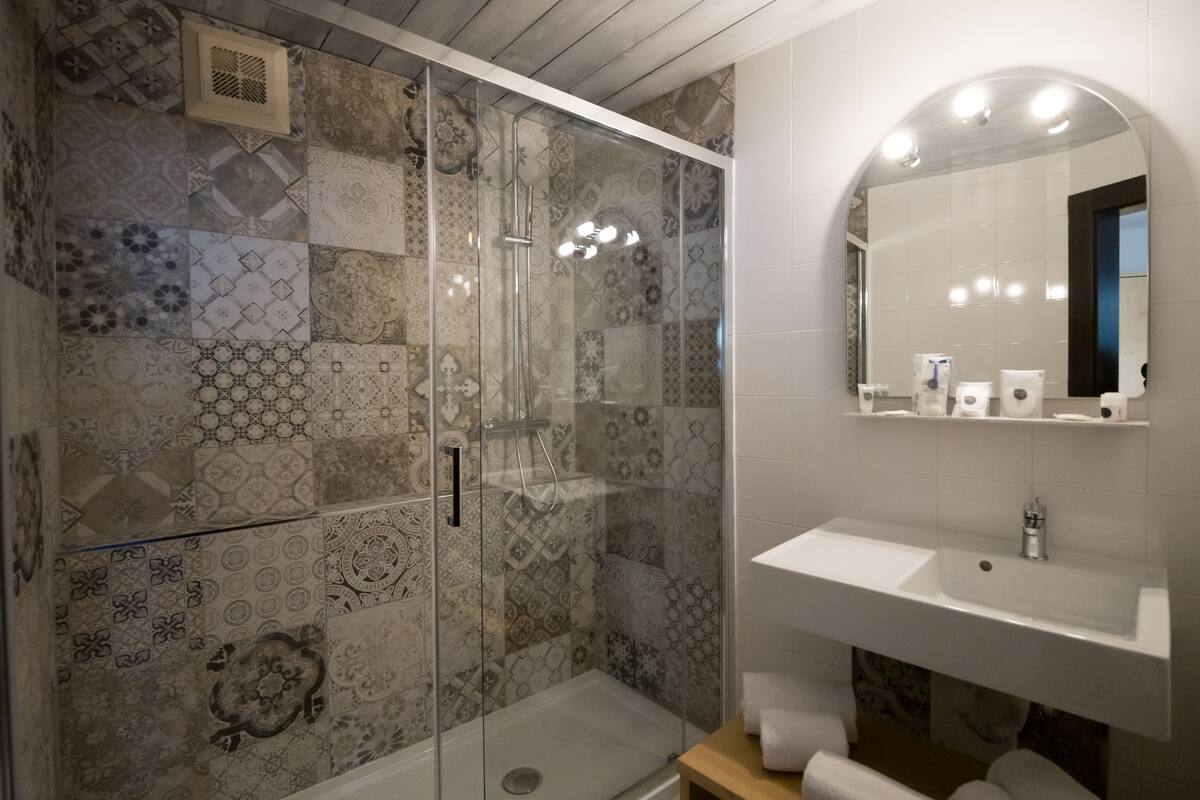 hair dryer, bathrobes, bidet, towels