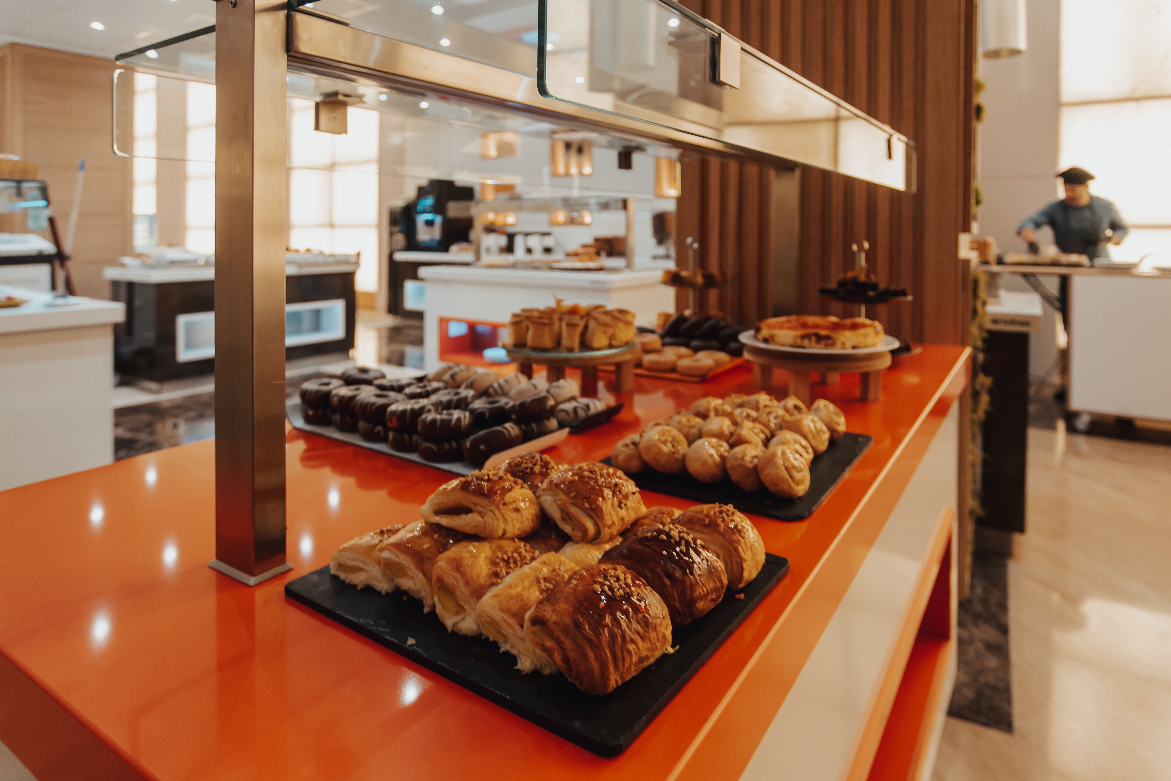 A buffet with various pastries and desserts.