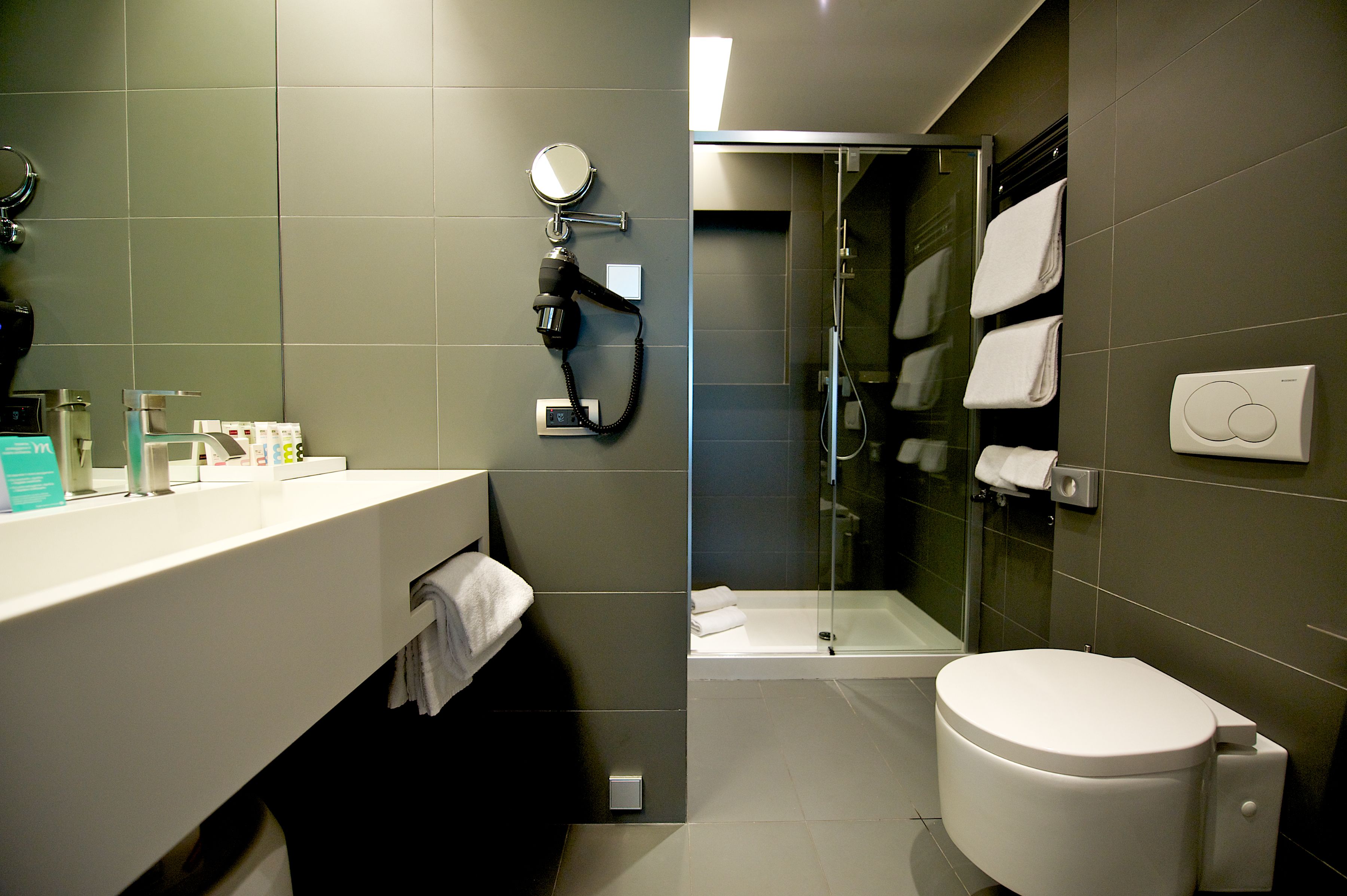 designer toiletries, hair dryer, bidet, towels