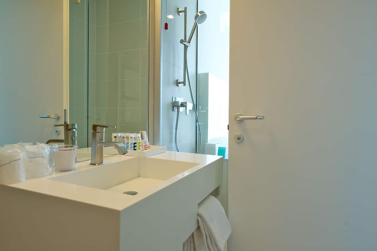 superior room, 1 king bed | bathroom | designer toiletries, hair dryer, bidet, towels