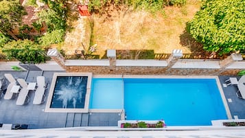 Seasonal outdoor pool, open 8:30 AM to 8:30 PM, pool umbrellas