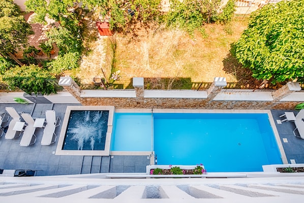 Seasonal outdoor pool, open 8:30 AM to 8:30 PM, pool umbrellas
