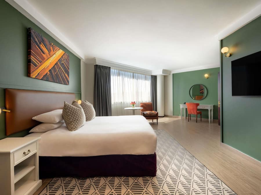 Suite, 1 Bedroom, Garden View | In-room safe, desk, blackout drapes, soundproofing