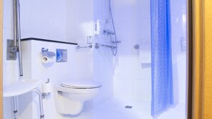 A modern bathroom with a toilet, sink, and shower. - Holiday Inn Express Madrid - Getafe by IHG (Getafe)