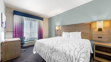 Desk, laptop workspace, blackout drapes, iron/ironing board