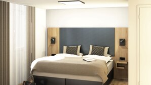 A modern bedroom with a bed, bedside tables, and a handbag on the floor. - Gästehaus Elisabeth (Tulfes)