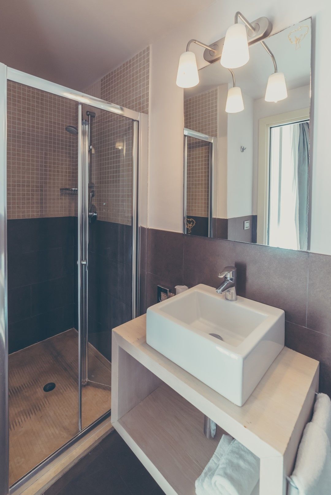 family room | bathroom | shower, rainfall showerhead, hair dryer, towels