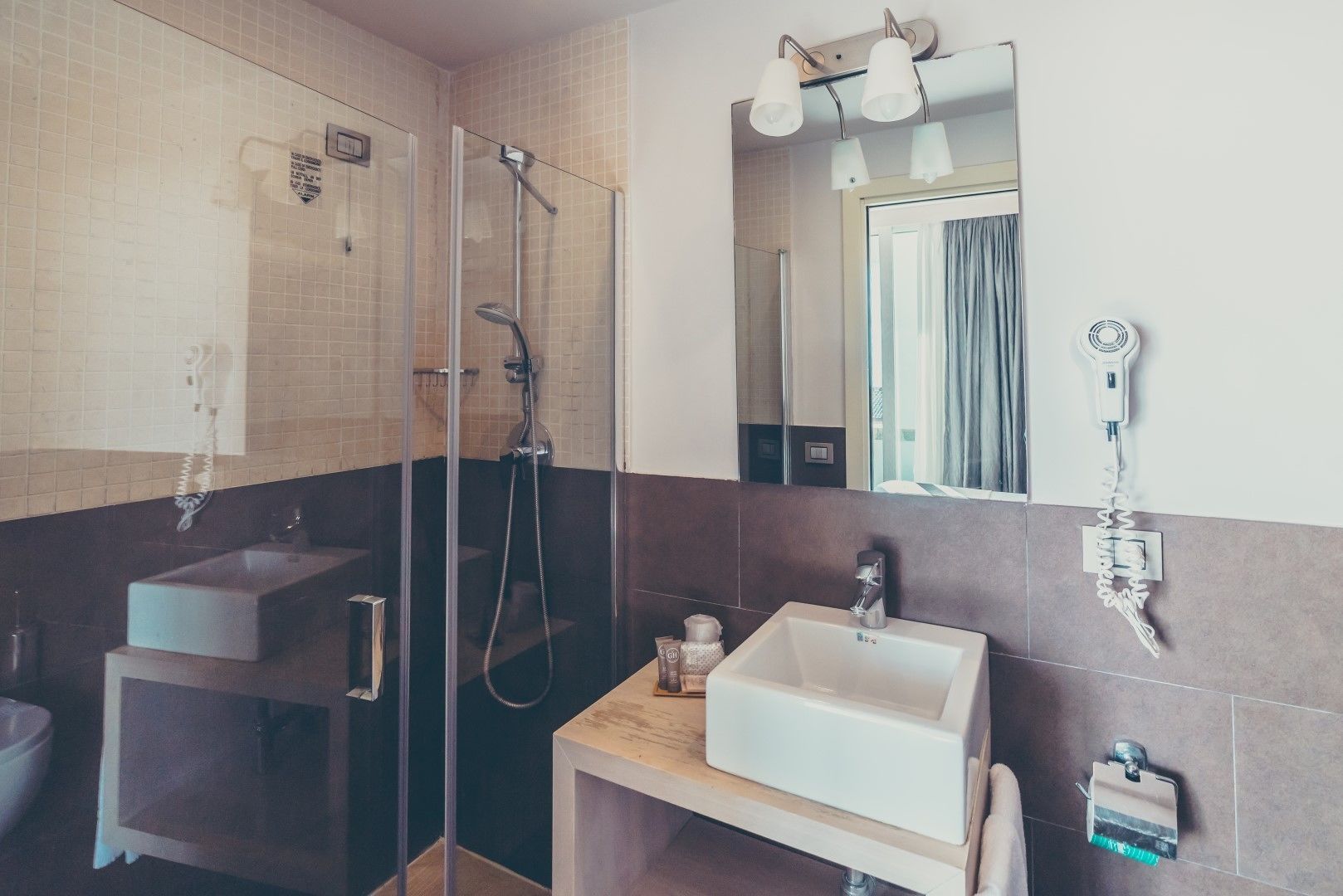 shower, rainfall showerhead, hair dryer, towels