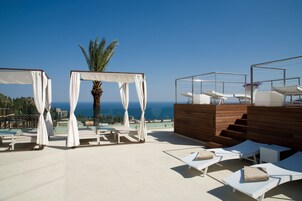 Outdoor pool, open 9 AM to 7 PM, pool umbrellas, sun loungers