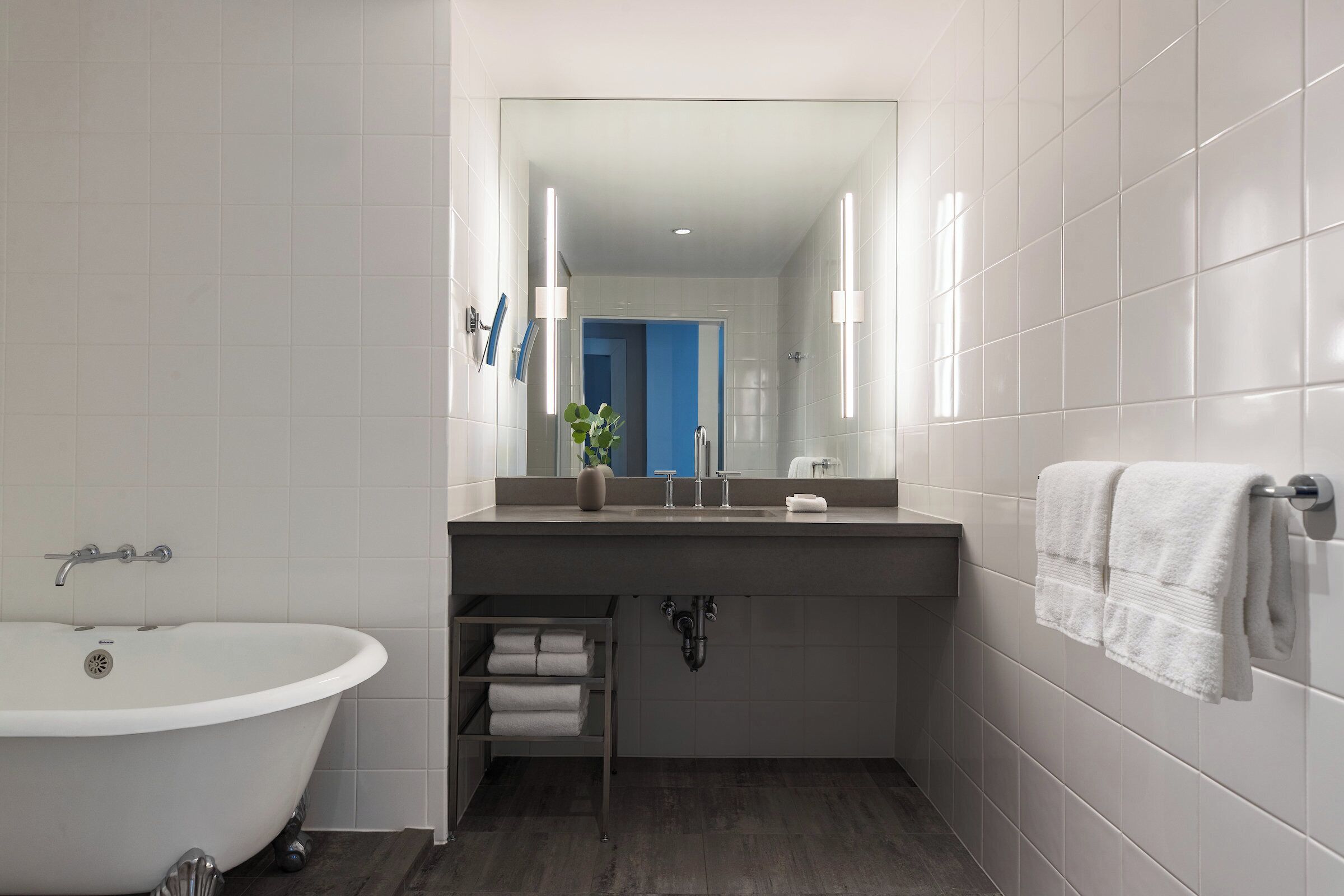 designer toiletries, hair dryer, bathrobes, slippers