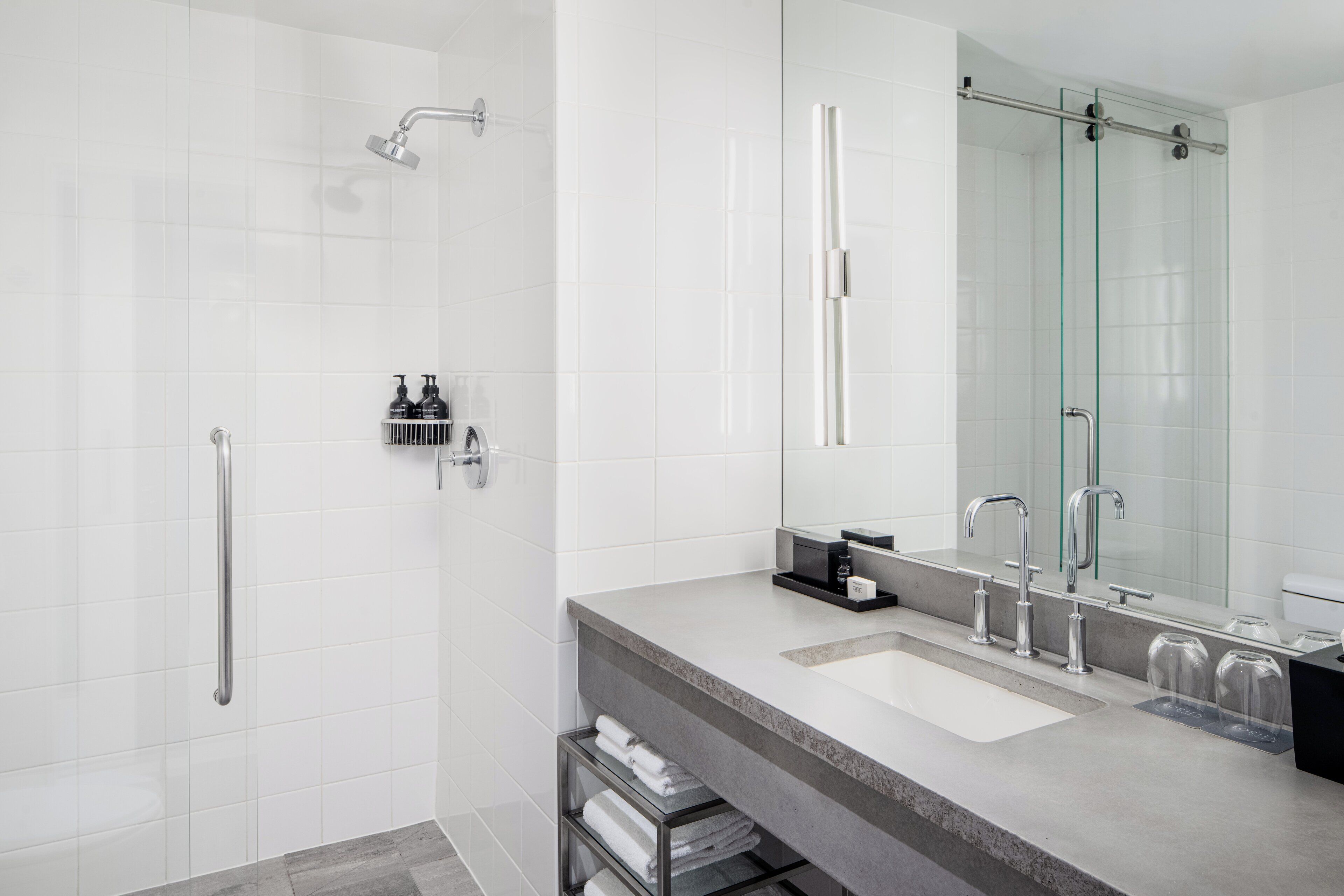 designer toiletries, hair dryer, bathrobes, slippers