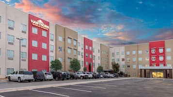 Experience the contemporary design of Hawthorn Suites, featuring a symmetrical facade and ample parking.